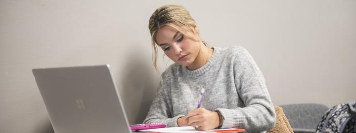 Student studying her class notes.